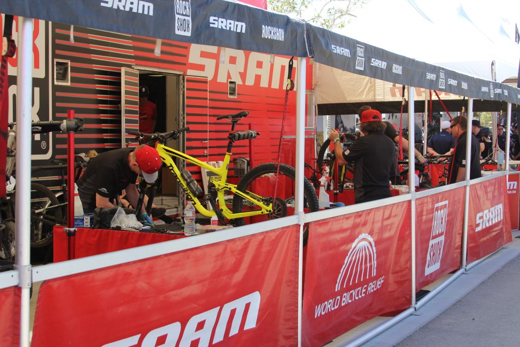 THE SERVICE BOOTHS LIKE SRAM ARE ALIVE WITH NONE STOP SERVICE. THESE GUYS ARE ON TOP OF IT TO KEEP THE RACERS GOING.