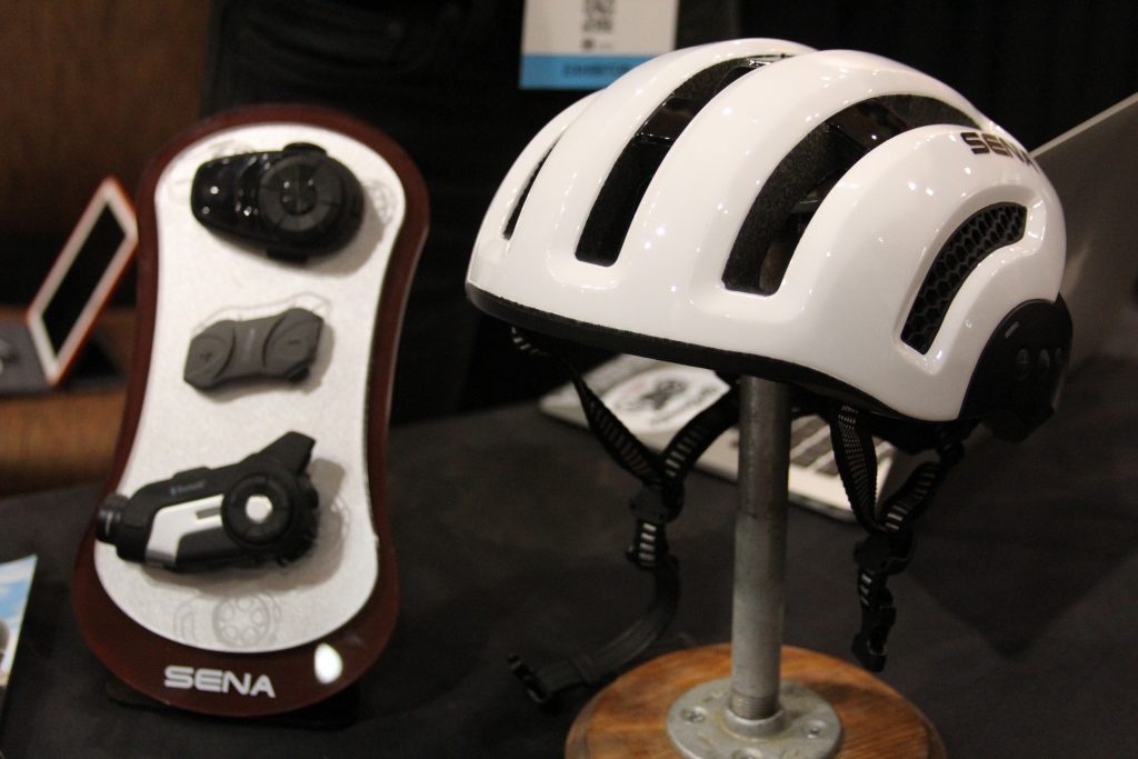 IF YOU RIDE MOTORCYCLES ON THE STREET, THEN CHANCES ARE YOU HAVE HEARD OF SENA. SENA HAS BEEN MAKING COMMUNICATION SYSTEM FOR THE MOTORCYCLE INDUSTRY FOR AWHILE NOW, THEY ARE CONSIDERED ONE OF THE TOP SYSTEMS.  WE DIDN'T KNOW THIS, BUT THEY ARE NOW ENTERING INTO THE CYCLING INDUSTRY. LIKE A FEW OUT THERE SENA IS MAKING THEIR SYSTEM BLUETOOTH CAPABLE WITH YOUR SMART PHONE. TAKE A CALL, MAKE A CALL, HEAR SOME MUSIC, OR GET TURN BY TURN INSTRUCTIONS. WOW SOUNDS KIND OD GOOD TO ME.   