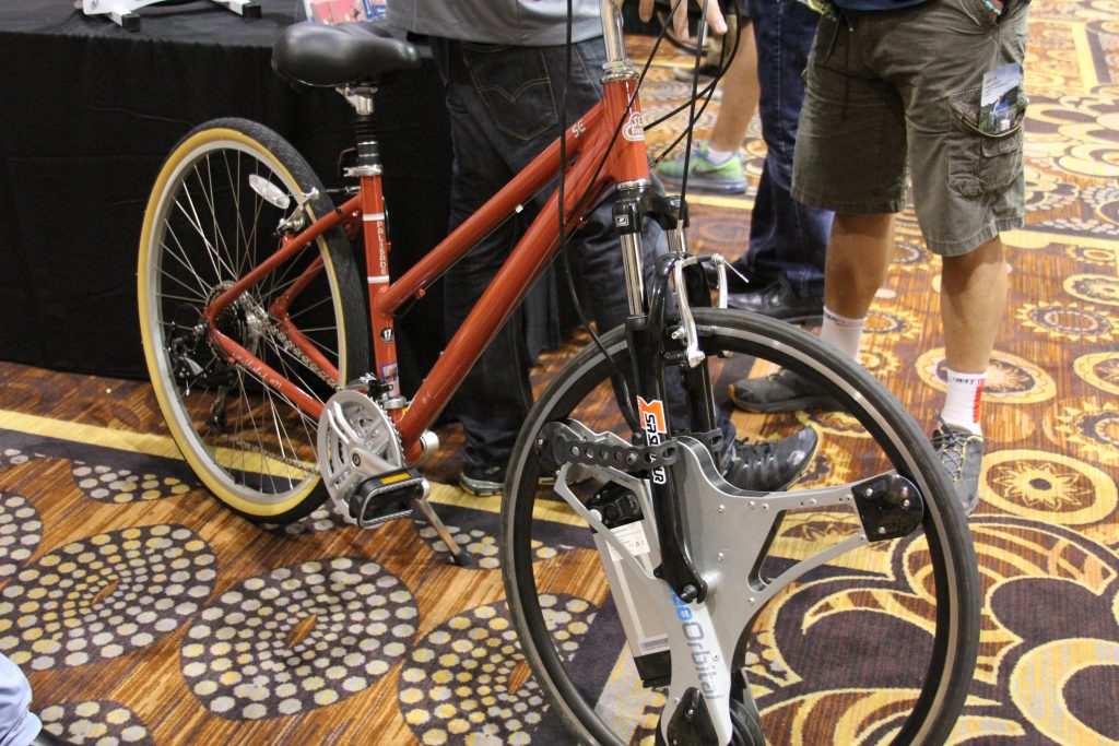 HERE IS A DIFFERENT TAKE ON E-BIKES.  WHY BUY A WHOLE BIKE WHEN ALL YOU NEED IS A WHEEL TO DRIVE YOUR BIKE. HHMMM, DO THEY MAKE A MOUNTAIN BIKE SETUP? 